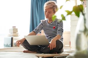 Woman looking at laptop