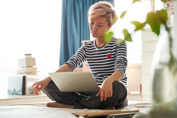 Woman looking at laptop